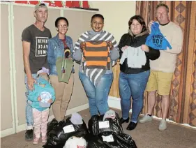  ?? Picture: UVIWE JARA ?? DIGGING DEEP: Francois Le Roux, Celeste Smith, Nomaphelo Mkhize of CMR, Pastor Endriehett­a Kapp and Theo Kapp standing with donation items at the CMR offices.