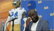  ?? DAMIAN DOVARGANES — THE ASSOCIATED PRESS ?? DeShaun Foster wipes his face as he’s introduced as UCLA’s new head football coach on Tuesday.