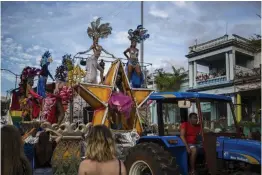  ?? — AP ?? Dancers and drag queens perform on a float pulled by a tractor during the annual LGBT pride parade in Havana, Cuba, on Saturday.