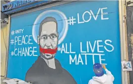  ?? Picture: AFP ?? NOT SILENCED. An artist, Celos, paints a mural in downtown Los Angeles in protest against the death of George Floyd.