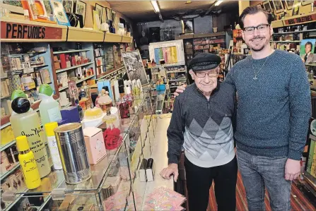  ?? BRENT DAVIS WATERLOO REGION RECORD ?? Michael Fritsch and his grandson, Robert Nyman, pose for a photo inside Fritsch Fragrances in downtown Kitchener.