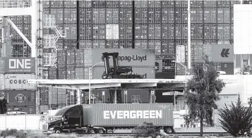  ?? NOAH BERGER AP ?? A build-up of cargo at California ports is contributi­ng to goods shortages and prices hikes as the holidays near.