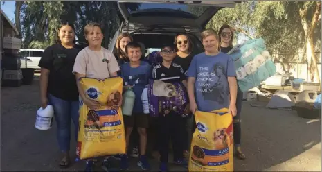  ?? PHOTO COURTESY OF DREW BRINNON ?? Southwest Valley 4-H members deliver supplies to the Humane Society as part of a service project this month.