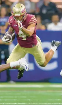  ?? AP MATTHEW HINTON | ?? Florida State wide receiver Mycah Pittman (4) announced he had surgery on a torn labrum on his left hip and could miss anywhere from 4-to-6 months. He shared the news on his YouTube channel.