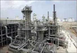 ?? MANEESH BAKSHI — THE ASSOCIATED PRESS FILE ?? FILE- In this file photo, a gas production facility is seen at Ras Laffan, Qatar. Qatar Petroleum said Saturday it has responded to a diplomatic crisis engulfing Qatar by mobilizing to mitigate the impact any action could have on its energy supplies to...