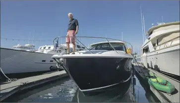  ?? Photograph­s by Myung J. Chun Los Angeles Times ?? BILL WOLF can’t even find a place to dock his powerboat at the California Yacht Club in Marina del Rey. Meanwhile, he’s fielding unsolicite­d offers from brokers willing to top the $1 million he paid five years ago.