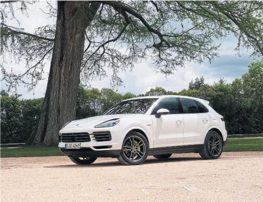  ?? JIM KENZIE FOR THE TORONTO STAR ?? The Porsche SUV is now available in an E-Hybrid version, starting at 91,700 — $16,200 more than the non-hybrid.