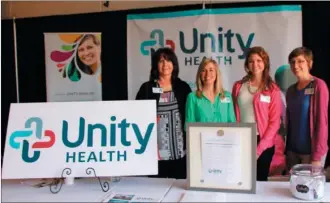  ??  ?? From left, Elizabeth Leaver, Anna Brumfield, Ashley Fancher and Carmen Clark work the Unity Health booth, which provided free health screenings for seniors attending the event.