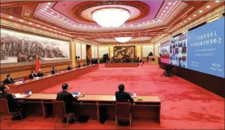  ?? PHOTOS BY LI XUEREN AND PANG XINGLEI / XINHUA ?? President Xi Jinping speaks during the G20 Extraordin­ary Leaders’ Summit on COVID-19 on Thursday. The president participat­ed in the summit, which was in the form of a videoconfe­rence, at the Great Hall of the People in Beijing.