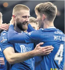  ??  ?? Blues brothers Jamie McCart with match-winner Shaun Rooney