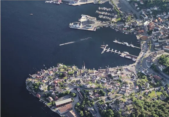  ?? Getty; AFP ?? Grimstad, above, is the town the mystery trader calls his home. Millions depend on Nordic power supplies, below