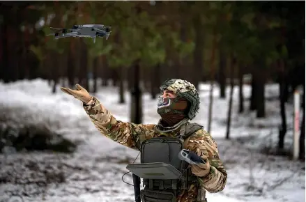 ?? AP ?? A Ukrainian serviceman lands a drone at his position close to the border with Belarus. Ukrainian units are monitoring the 1000km frontier for a possible surprise offensive from the north, a repeat of the unsuccessf­ul Russian thrust towards Kyiv at the start of the war nearly a year ago.