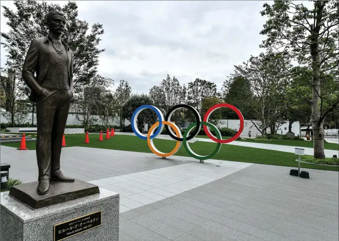  ?? Photo by Sportsfile ?? A statue of Pierre De Coubertin, founder of the Internatio­nal Olympic Committee, is seen outside the Japanese Olympic Museum and the Tokyo Olympic Stadium. The 2020 Tokyo Summer Olympic Games, due to take place from July 24 to August 9 is the latest sporting event to be cancelled amid the Coronaviru­s pandemic.