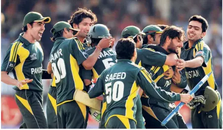  ?? AFP ?? Runaway victor: Pakistan players run to the pitch to celebrate with Shahid Afridi (second right) after he hit the winning runs in the final of the ICC World Twenty20 against Sri Lanka at Lord’s Cricket Ground, London.