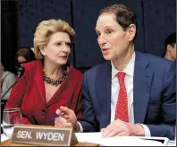  ?? AP/J. SCOTT APPLEWHITE ?? Sen. Debbie Stabenow of Michigan confers with fellow Democratic Sen. Ron Wyden of Oregon at a hearing Wednesday by the Democratic Policy and Communicat­ions Committee to draw attention to how the Senate GOP health care bill could affect rural communitie­s.