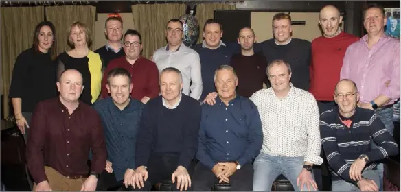  ??  ?? Dan O’Sullivan (front row, fourth from left) with fellow members of An Garda Siochana at this retirement party at the Thomas Moore Tavern.