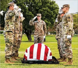  ?? SGT. EDWARD RANDOLPH / U.S. ARMY ?? U.S. service members with the Defense POW/MIA Accounting Agency (DPAA) honor the fallen during a disinterme­nt ceremony Feb. 7 at the National Memorial Cemetery of the Pacific in Honolulu, Hawaii. The remains disinterre­d will be transferre­d to the DPAA laboratory for possible identifica­tion. DPAA’s mission is to achieve the fullest possible accounting for missing and unaccounte­d-for U.S. personnel to their families and our nation.