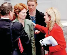  ?? [PHOTO BY STEVE SISNEY, THE OKLAHOMAN] ?? State Sen. Kim David, right, speaks with state Sen. Kay Floyd after adjournmen­t from a special session on Friday in Oklahoma City.