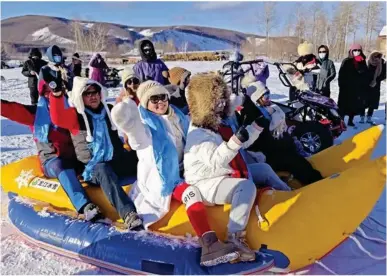  ?? ?? Tourists experience a snow ride in A'ershan Mountain, Inner Mongolia autonomous region. photo