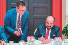  ??  ?? WAM Dr Shaikh Sultan signs copies of his latest novel ‘Baby Fatima and the King’s Sons’ on the sidelines of the Frankfurt Book Fair.