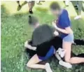  ?? CAIR FLORIDA/COURTESY ?? Video recorded Thursday shows a group of high school girls ganging up on a West Boca High student, 14.