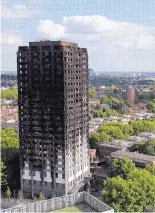  ?? KIRSTY WIGGLESWOR­TH/ASSOCIATED PRESS ?? The remains of Grenfell Tower in London. Experts believe exterior cladding, which contained insulation, helped spread the flames quickly up the outside of the public housing tower Wednesday.