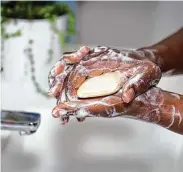  ?? Tribune News Service file photo ?? The CDC still recommends hand-washing after preparing food and being in a public space.