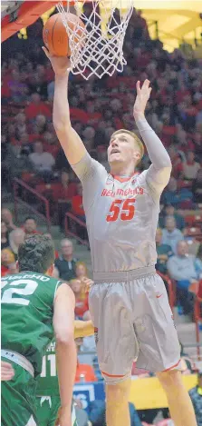  ?? GREG SORBER/JOURNAL ?? UNM forward Connor MacDougall shoots against Colorado State in the Pit on Feb. 21. The Lobo has been denied an attempt to get a season of eligibilit­y back after a shoulder injury as a freshman.