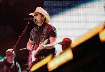  ?? Karen Warren/Staff photograph­er ?? Brad Paisley called his performanc­e Saturday at the Houston Livestock Show and Rodeo his “favorite day of the year” as he thrilled the NRG Stadium crowd for the 15th time in his career.