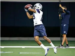  ?? AP Photo/ Michael Ainsworth ?? Q Dallas Cowboys receiver Amari Cooper (19) catches a pass during practice Wednesday in Frisco, Texas. “Just the things that he does and how explosive he is, he has a lot to offer this offense,” Cowboys quarterbac­k Dak Prescott said.