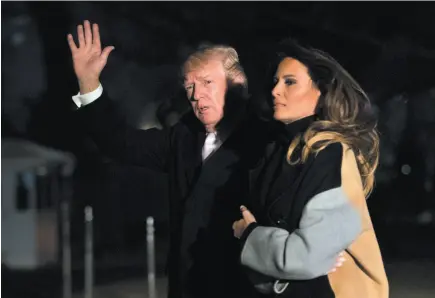  ?? AP PHOTO ?? U.S. President Donald Trump with first lady Melania Trump waves as he returns to the White House in Washington, on Monday. Trump spent the holiday weekend at his Mar-a-Lago estate in Palm Beach, Fla.