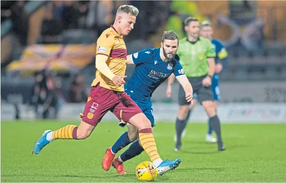  ??  ?? Jamie Ness in action for Dundee before coming off in Saturday night’s 3-0 Scottish Cup fourth-round defeat to Motherwell at Dens.