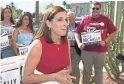  ?? NICK OZA/THE REPUBLIC ?? U.S. Rep. Martha McSally, with her supporters, files her signatures to appear on the ballot for U.S. Senate at the Arizona Secretary of State's Office on May 29.