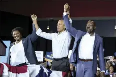  ?? AP photo ?? Former President Barack Obama (center), stands with Georgia gubernator­ial candidate Stacey Abrams and candidate for U.S. Senate, Sen. Raphael Warnock D-Ga., during a campaign rally Friday, in College Park, Ga.