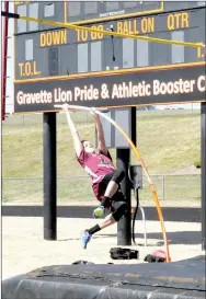  ?? MARK HUMPHREY ENTERPRISE-LEADER ?? Lincoln freshman Connor Schork fearlessly begins his ascent after planting the pole. Schork won fifth place in pole vault during the 4A-1 District Junior High Track and Field Meet hosted by Gravette Thursday.