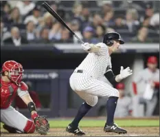  ?? AP PHOTO/MARY ALTAFFER ?? New York Yankees’ Brett Gardner (right) watches his RBI-double during the sixth inning of a baseball game against the Los Angeles Angels, on Thursday, in New York.