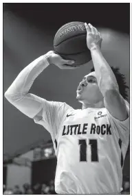  ?? Arkansas Democrat-Gazette/MITCHELL PE MASILUN ?? UALR guard Jaizec Lottie (11) has an injured hand and his status for the Trojans’ games against Texas Arlington and Texas State this week is unknown.