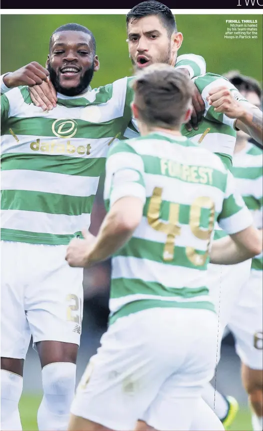  ??  ?? FIRHILL THRILLS Ntcham is hailed by his team-mates after netting for the Hoops in Partick win