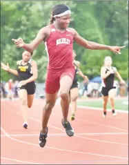  ?? Peter Hvizdak / Hearst Connecticu­t Media ?? Right, Terry Miller of Bulkeley High School wins a girls 100-meter dash qualifying run for the finals during the CIAC Class M meet on Monday in New Britain.