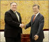  ?? AP/AHN YOUNG-JOON ?? South Korean President Moon Jae-in (right) greets U.S. Secretary of State Mike Pompeo during a meeting at the presidenti­al Blue House on Sunday in Seoul, South Korea.