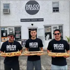  ?? SUBMITTED PHOTO ?? Left to right, Nick and Steve Reynolds and John McKenzie, owners of Delco Steaks in Broomall, will hold a grand opening celebratio­n Saturday featuring free Delco
Lager, courtesy of 2SP Brewing Company, as well as a cheesestea­k competitiv­e eating contest.