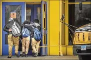  ?? MARK MIRKO / THE HARTFORD COURANT ?? Students at the Sport and Medical Sciences Academy return to school Wednesday in Hartford, Connecticu­t. The school had been closed since a student died from a fentanyl overdose.