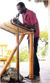  ??  ?? Sanjae Facey, firefighte­r and poet, reads from his work on Saturday at the 2018 Calabash Internatio­nal Literary Festival in Treasure Beach, St Elizabeth.