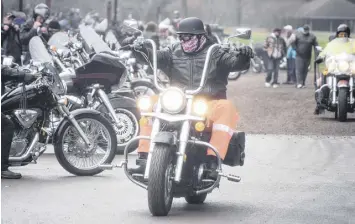  ?? FRAM DINSHAW/TRURO NEWS ?? Fully suited up in his helmet and goggles, a motorcycli­st prepares to leave Victoria Park after the annual Blessing of the Bikes ceremony on May 4.