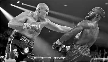  ??  ?? Tyson Fury versus Deontay Wilder. (Photo: Fox News Asia)