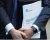  ?? PHOTO: GETTY IMAGES ?? Conservati­ve Party politician Steve Baker holds a Brexit document yesterday.