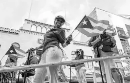  ?? AILEEN PERILLA/CORRESPOND­ENT ?? The Florida Puerto Rican Parade and Festival honored Puerto Ricans in public service. Bands performed Latin music as attendees danced in the grass in downtown Orlando.