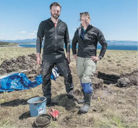  ?? FREDDIE CLAIRE/PBS/THE CANADIAN PRESS ?? Archeologi­sts Doug Bolender and Sarah Parcak visit Point Rosee, N.L., where they believe they have found a former Viking settlement.