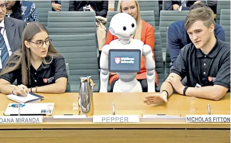  ??  ?? Pepper the robot appears before the education select committee. MPS asked her about the future of artificial intelligen­ce and she reassured them humans would always be needed