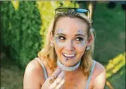  ??  ?? Taylor Freeman says she used a kit to add glitter to her face before heading to Zilker Park for ACL Fest this year.